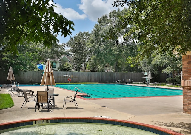 view of pool featuring a patio area