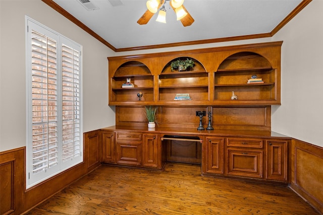 unfurnished office featuring crown molding, ceiling fan, and hardwood / wood-style floors