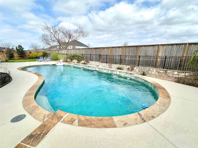 view of pool featuring a fenced in pool and a fenced backyard