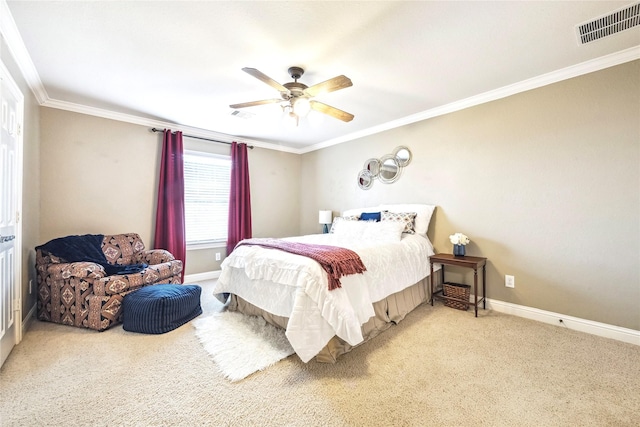 bedroom featuring carpet floors, ornamental molding, visible vents, and baseboards