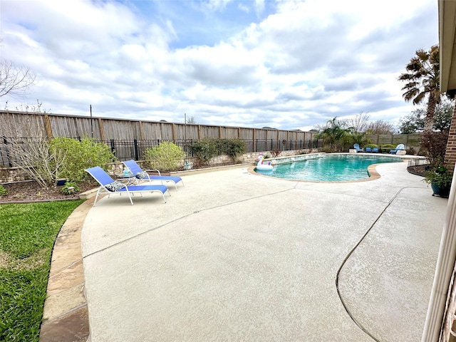 view of pool with a patio, a fenced in pool, and a fenced backyard