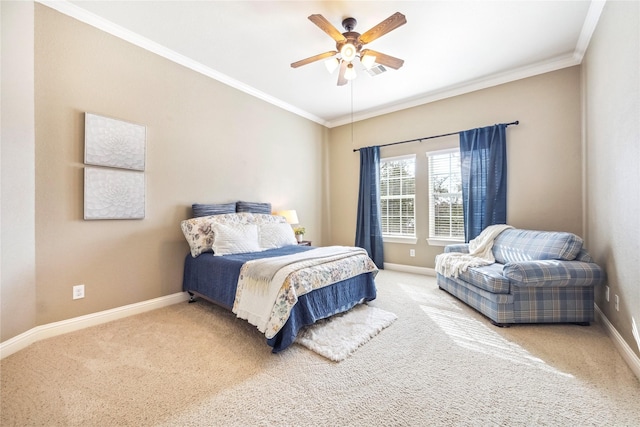 bedroom featuring crown molding, baseboards, and carpet flooring