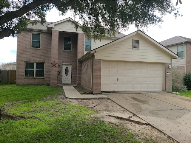 view of front property featuring a garage and a front yard