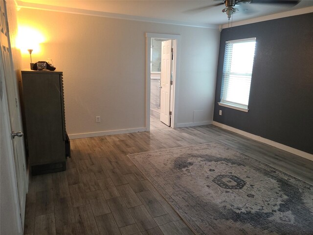 spare room with ceiling fan and dark hardwood / wood-style flooring