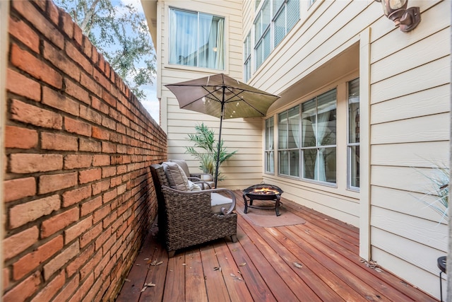 deck featuring an outdoor fire pit