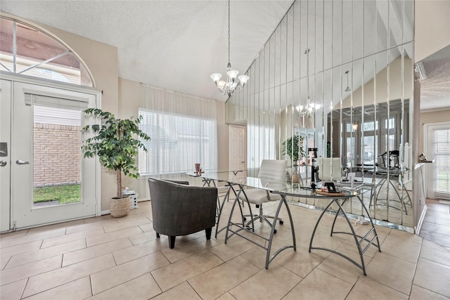 tiled dining area featuring a chandelier, high vaulted ceiling, and a textured ceiling