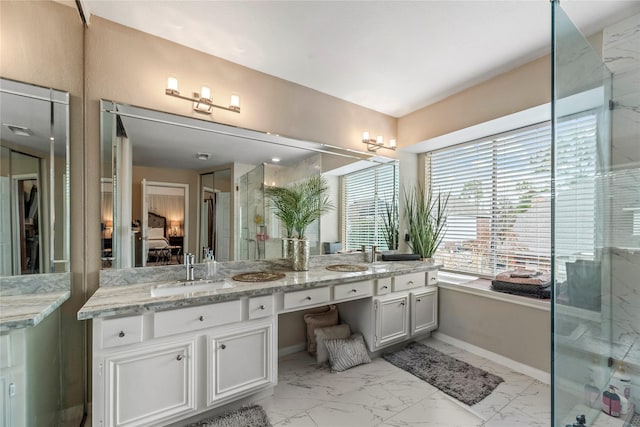 bathroom featuring vanity and an enclosed shower