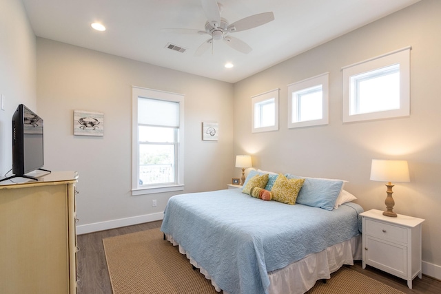 bedroom featuring ceiling fan, recessed lighting, visible vents, baseboards, and dark wood-style floors