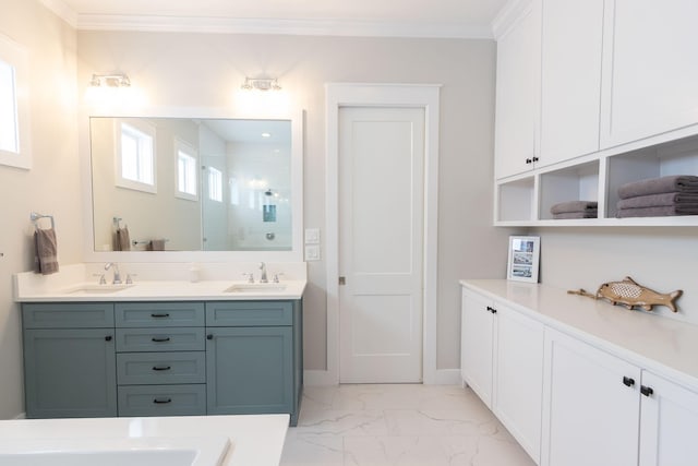 bathroom with ornamental molding, a stall shower, marble finish floor, and a sink