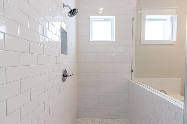 full bathroom with a tile shower