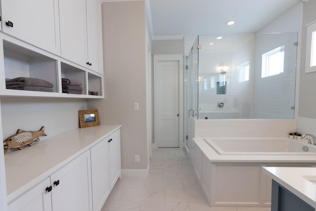 bathroom with vanity, baseboards, marble finish floor, a bath, and a stall shower