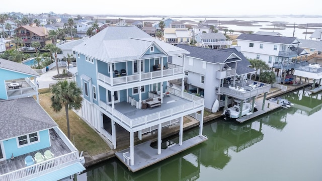 aerial view featuring a water view and a residential view