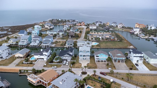 bird's eye view with a residential view and a water view