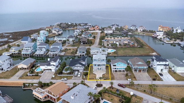 bird's eye view with a water view and a residential view