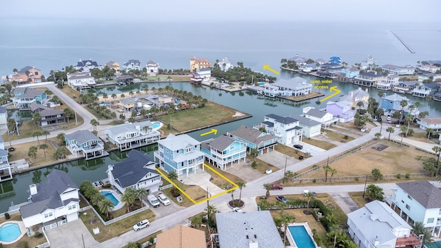 aerial view featuring a water view and a residential view