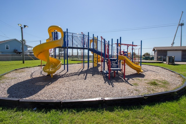 community play area featuring a lawn