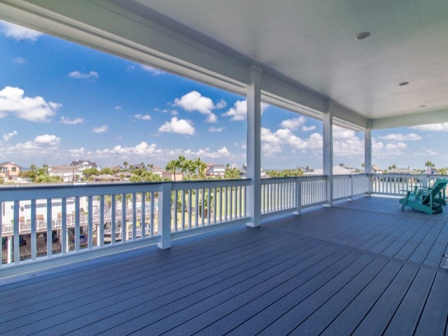 wooden terrace featuring a water view