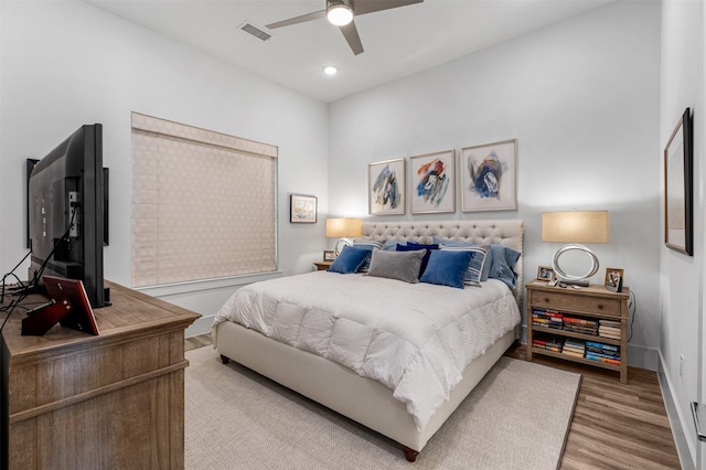 bedroom featuring ceiling fan and hardwood / wood-style floors