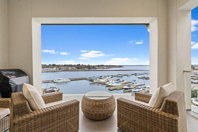 balcony featuring grilling area and a water view