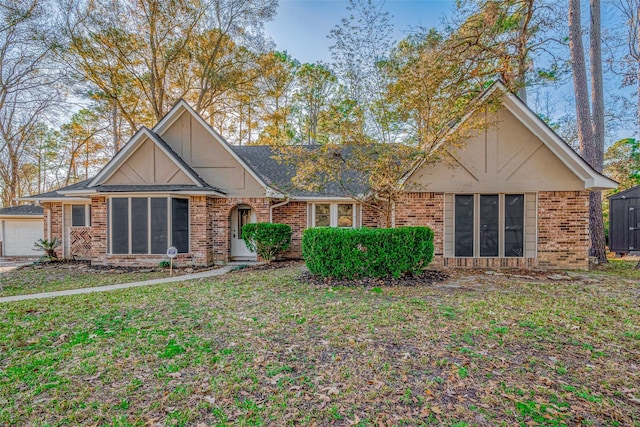 view of front of home with a garage and a front yard