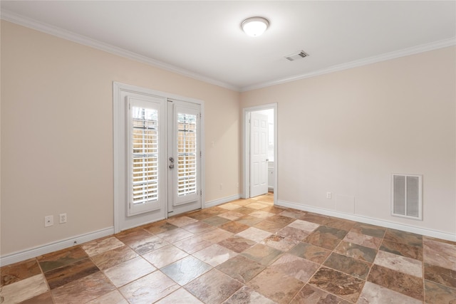 empty room with ornamental molding and french doors