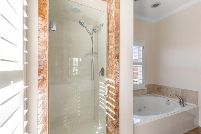 bathroom featuring ornamental molding and shower with separate bathtub