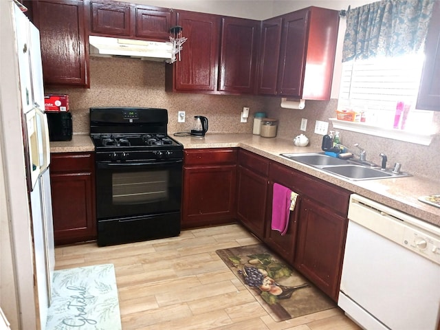 kitchen featuring sink, white appliances, backsplash, and light wood-type flooring