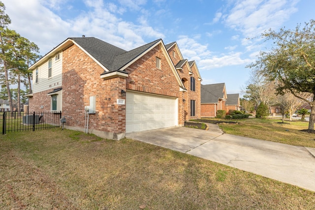 view of front of home with a garage, a front yard, brick siding, and fence