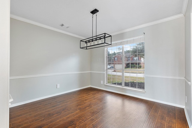 unfurnished dining area with ornamental molding and dark wood-type flooring