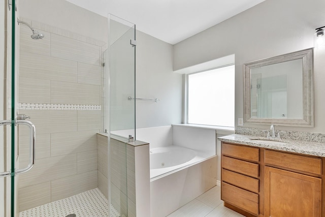 full bath with a shower stall and vanity