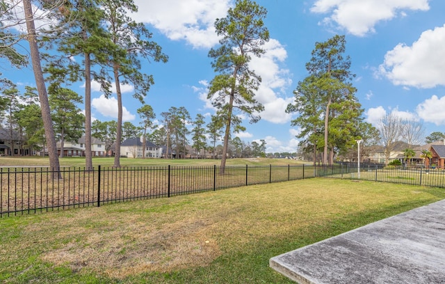 view of yard with fence and a residential view