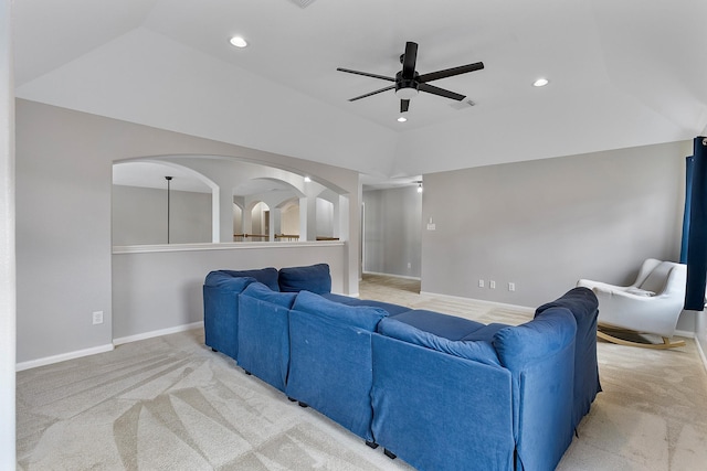 living room featuring vaulted ceiling, carpet flooring, and ceiling fan