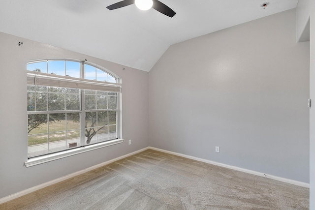 unfurnished room with carpet, lofted ceiling, and ceiling fan