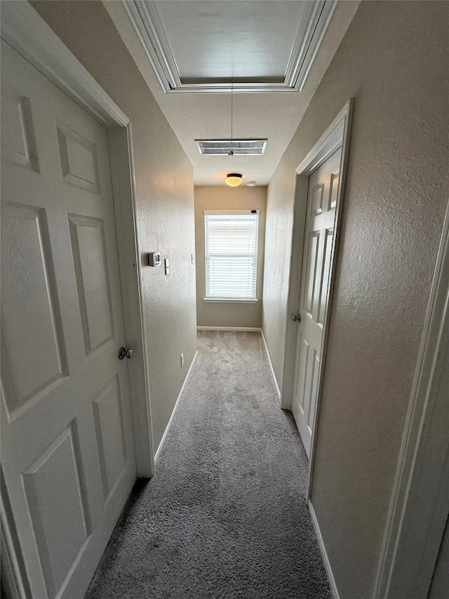 hall featuring light colored carpet