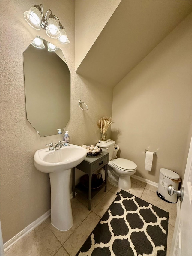 bathroom featuring tile patterned floors and toilet