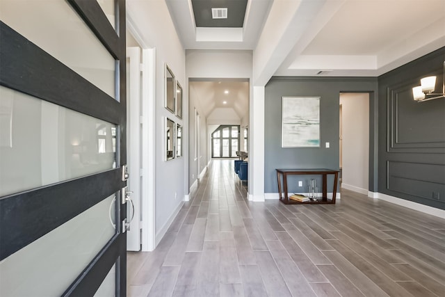 11910 Gramina Way, Humble, TX 77346 - foyer entrance featuring a tray ceiling, baseboards, and wood finished floors