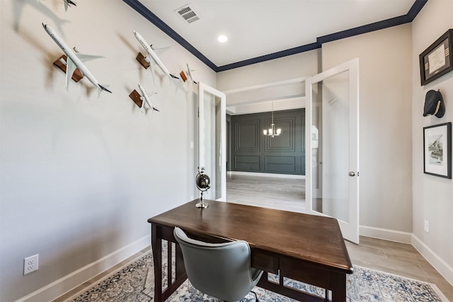 office area featuring ornamental molding, a notable chandelier, and light hardwood / wood-style floors