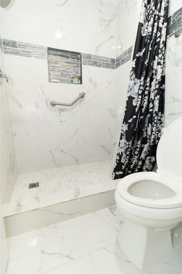 full bath featuring toilet, a stall shower, and marble finish floor