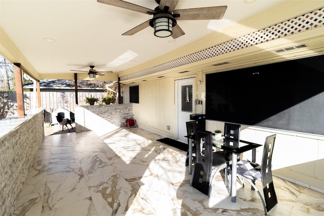 view of patio with visible vents, a ceiling fan, and fence