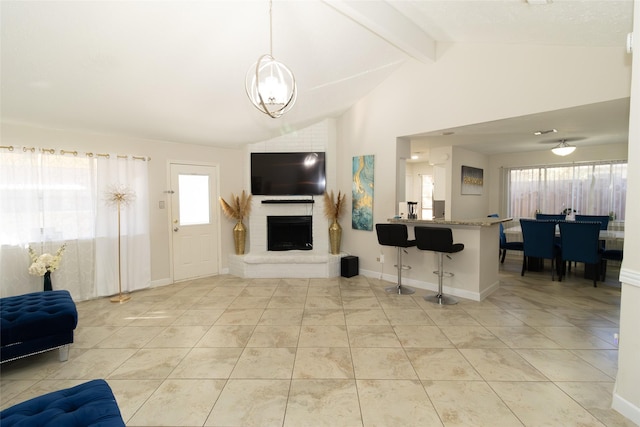 tiled living room featuring a fireplace and lofted ceiling with beams