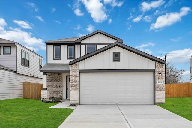 view of front of house with a garage and a front yard