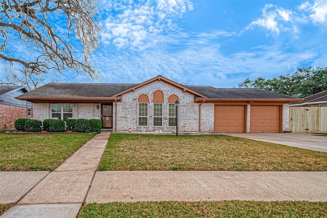 ranch-style house featuring a garage and a front yard