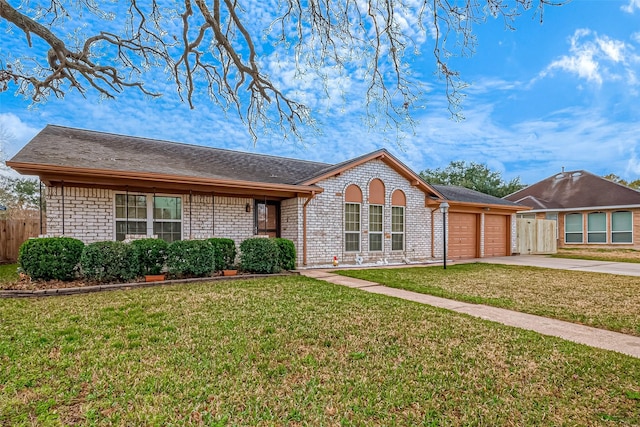 single story home featuring a garage and a front lawn