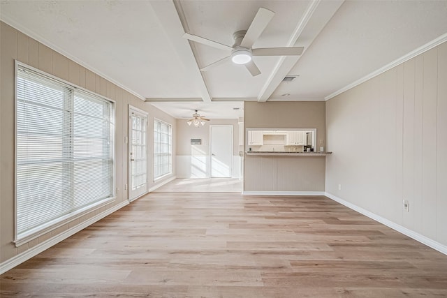 unfurnished living room featuring ceiling fan, crown molding, and light hardwood / wood-style floors