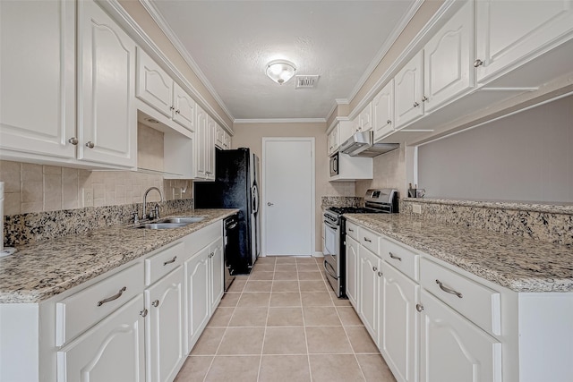 kitchen with white cabinetry, sink, ornamental molding, light stone counters, and stainless steel gas range