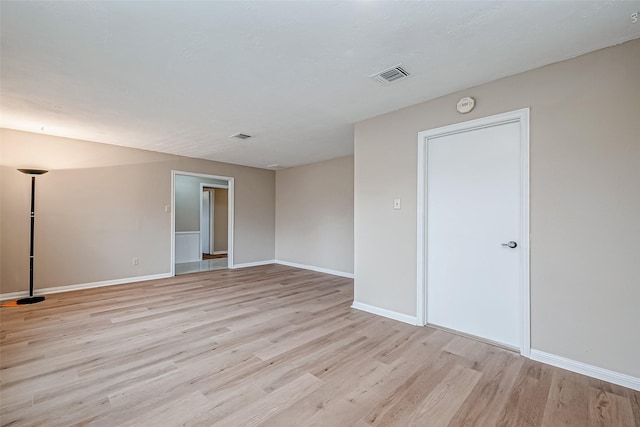 spare room featuring light hardwood / wood-style flooring