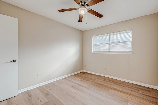 spare room with light hardwood / wood-style floors and ceiling fan