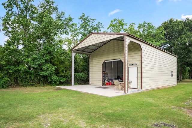 view of outbuilding featuring a lawn