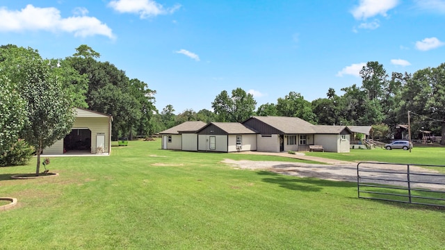 ranch-style home featuring a garage and a front lawn