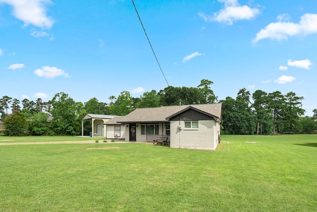 back of property with a yard